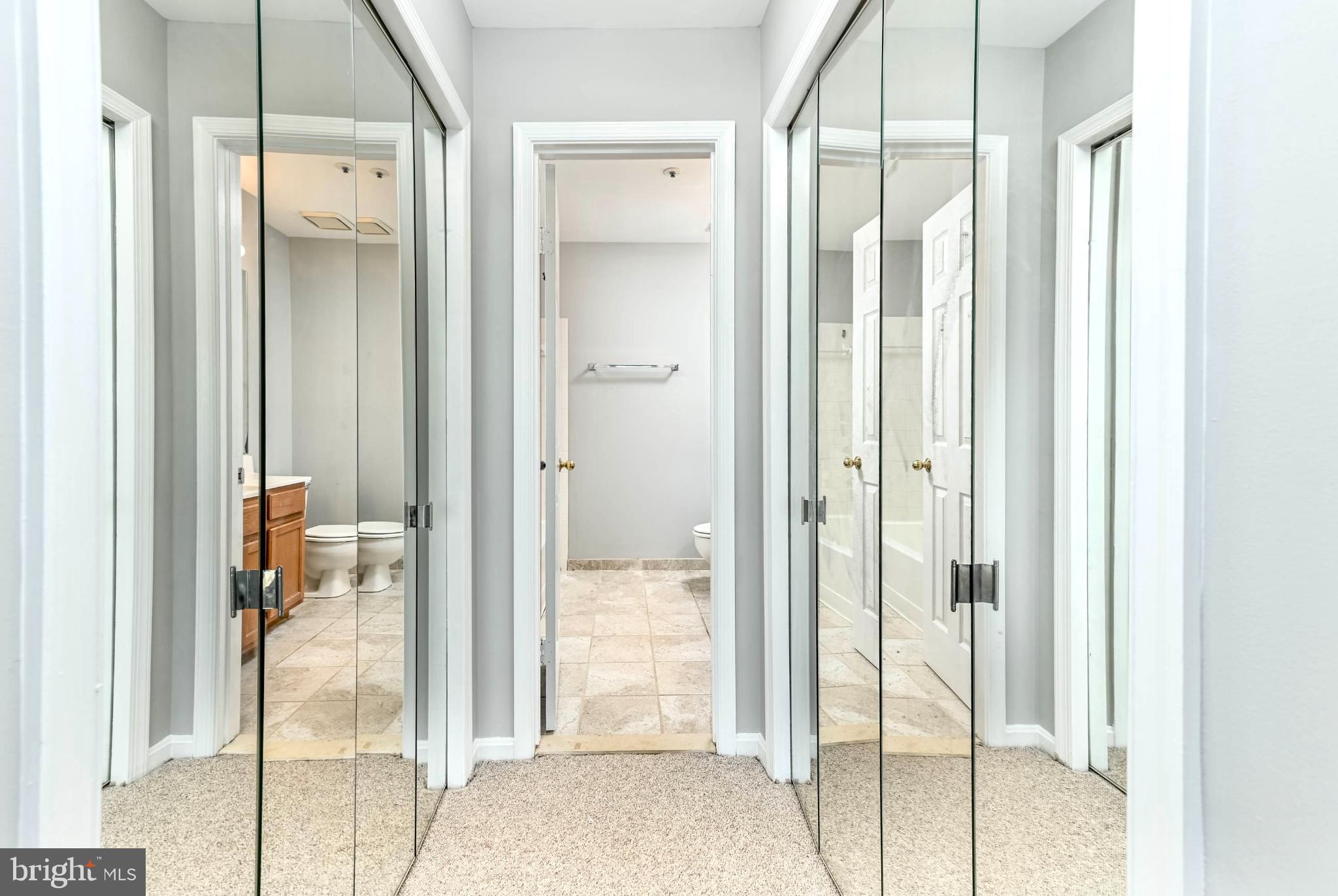 11152 Stagestone Way Manassas, VA 20109 - Photo 13 of 22 a bathroom with a glass shower door and a mirror
