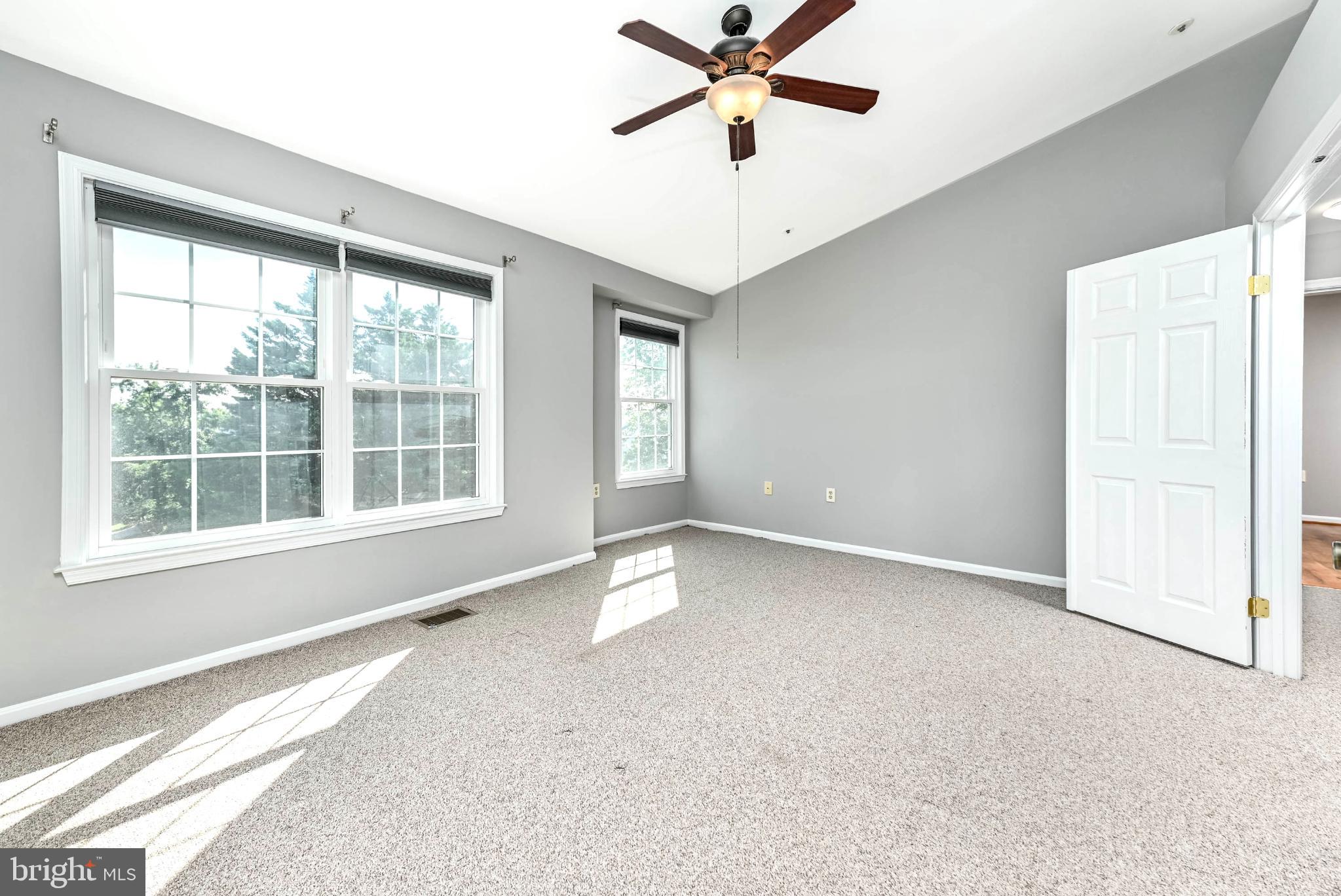 11152 Stagestone Way Manassas, VA 20109 - Photo 15 of 22 an empty room with a window and a ceiling fan