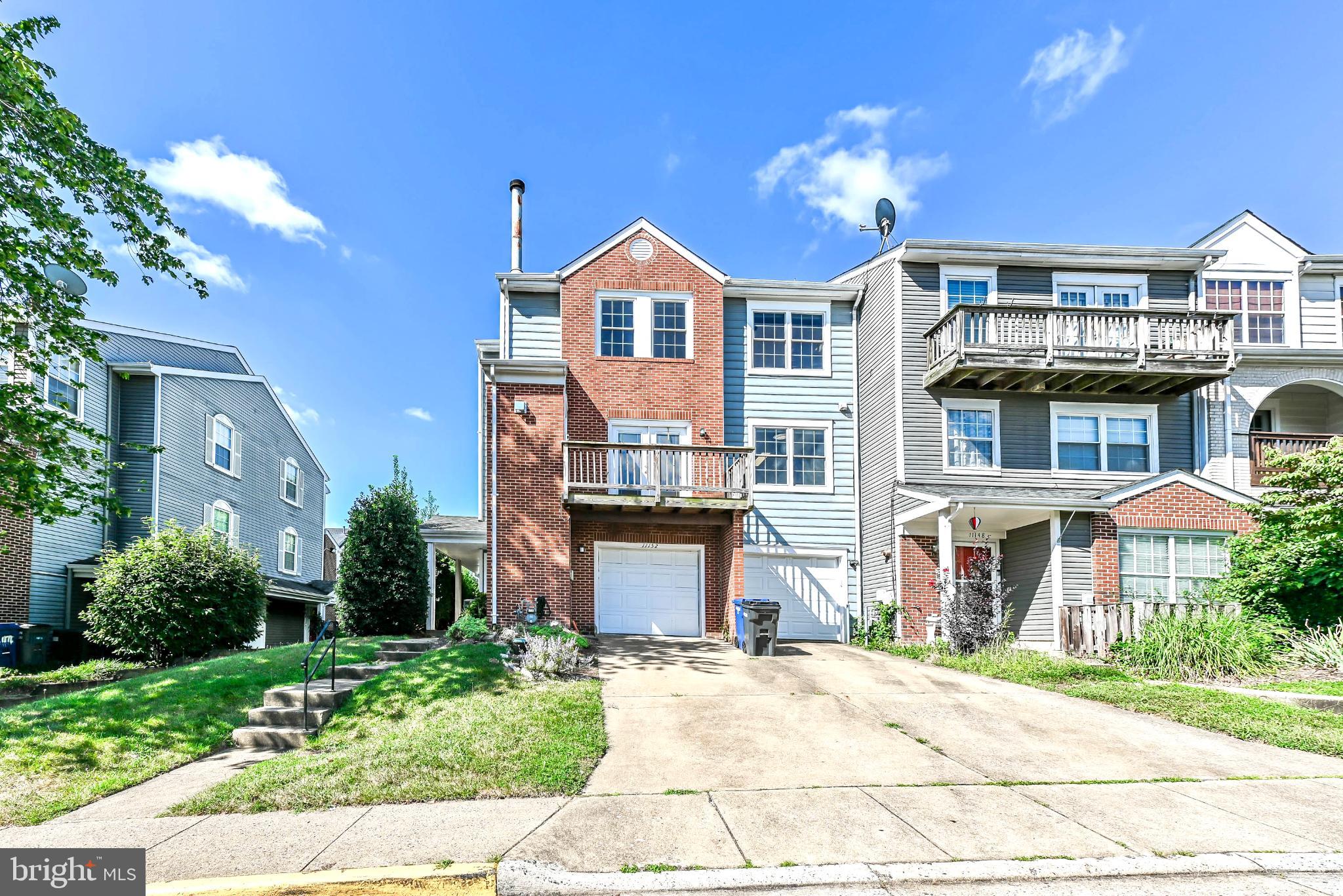 11152 Stagestone Way Manassas, VA 20109 - Photo 21 of 22 a front view of a house with a yard and garage
