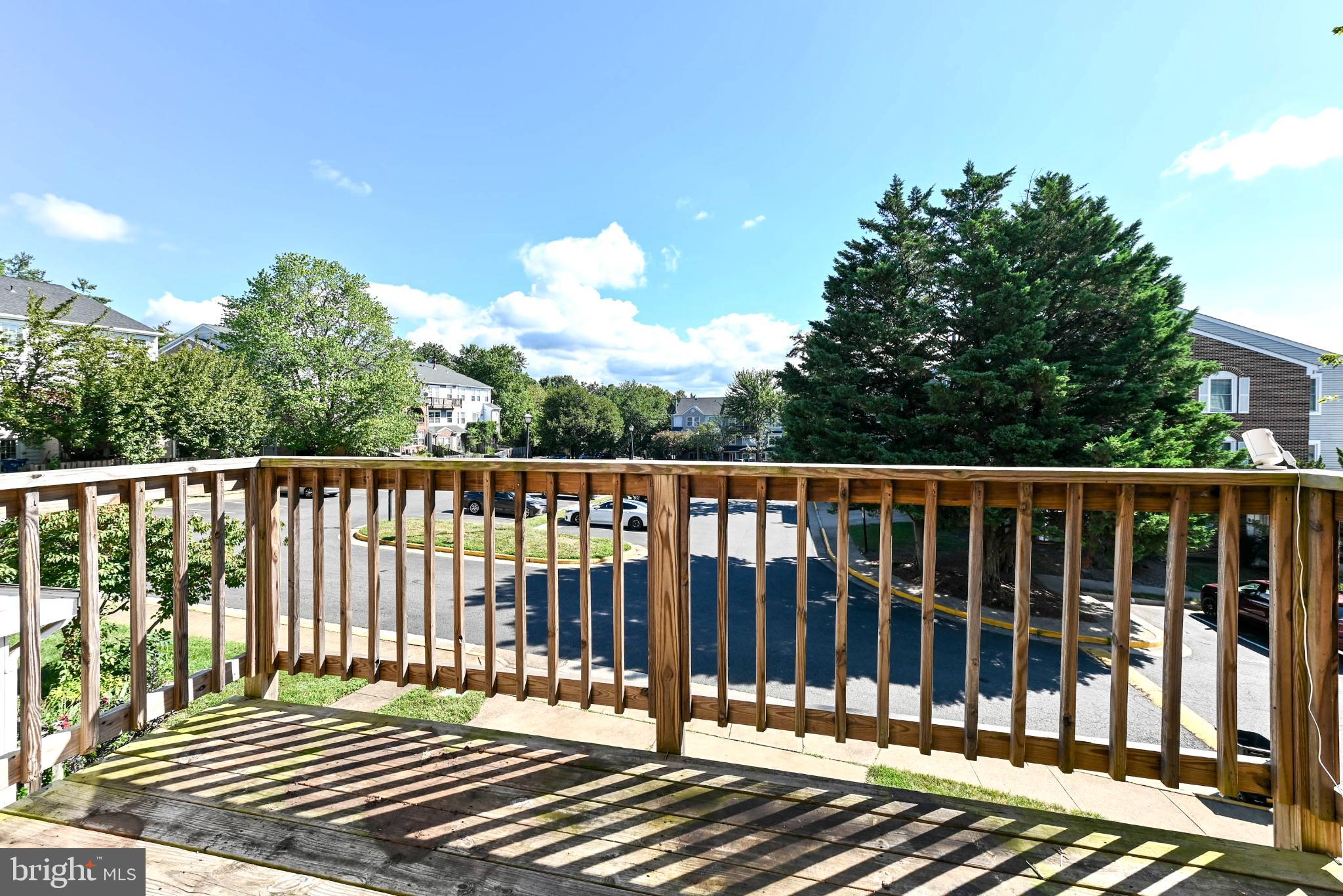 11152 Stagestone Way Manassas, VA 20109 - Photo 22 of 22 a view of a balcony with wooden fence