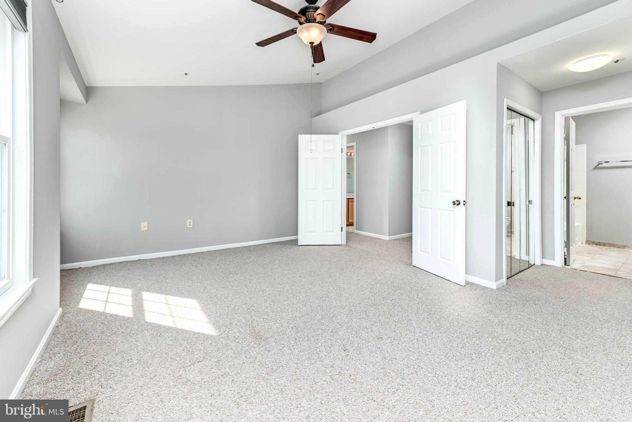 11152 Stagestone Way Manassas, VA 20109 - Photo 10 of 22 a view of a livingroom with a ceiling fan and window