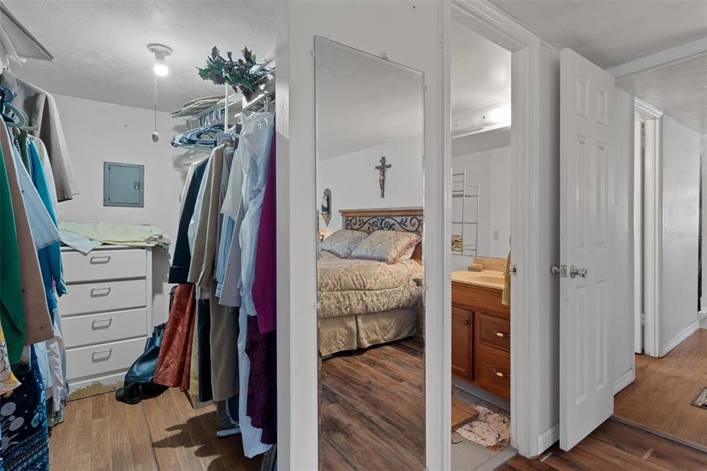 22439 Bull Run Road Brooksville, FL 34602 - Photo 26 of 66 a view of walk in closet with clothes and shoes