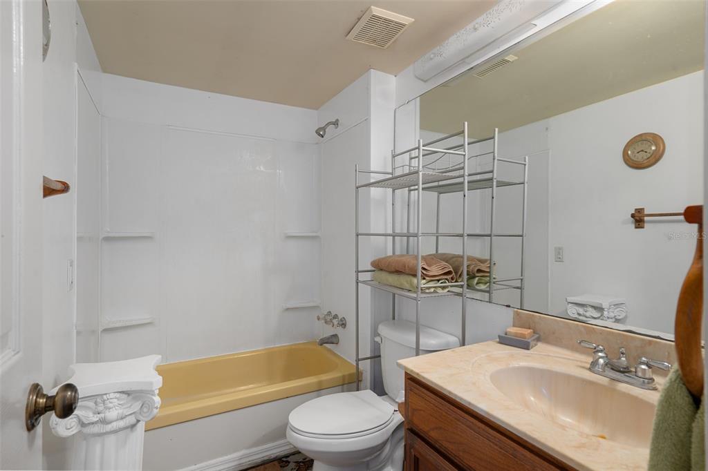 22439 Bull Run Road Brooksville, FL 34602 - Photo 27 of 66 a bathroom with a sink a toilet and shower