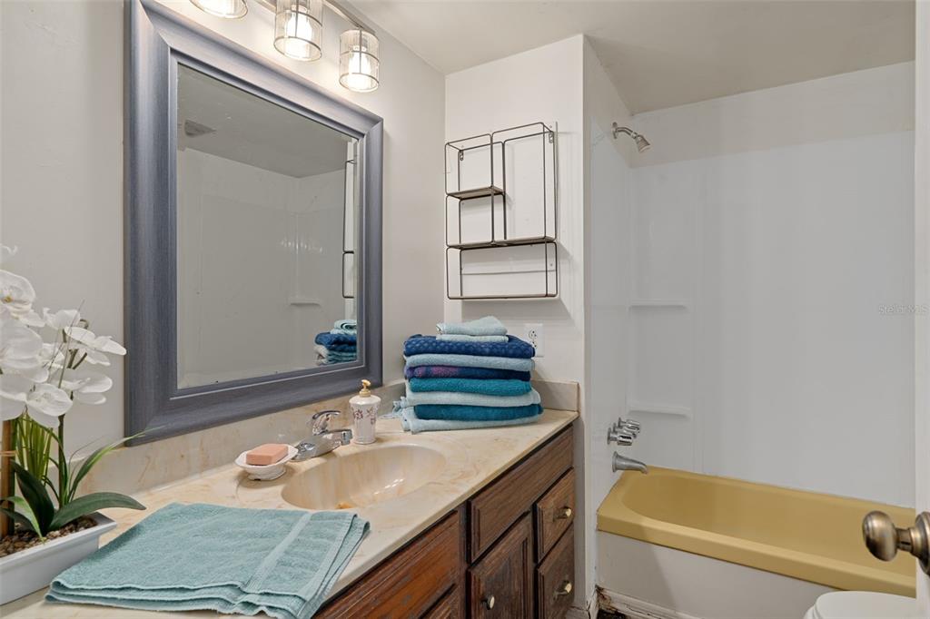 22439 Bull Run Road Brooksville, FL 34602 - Photo 29 of 66 a bathroom with a granite countertop sink and a mirror