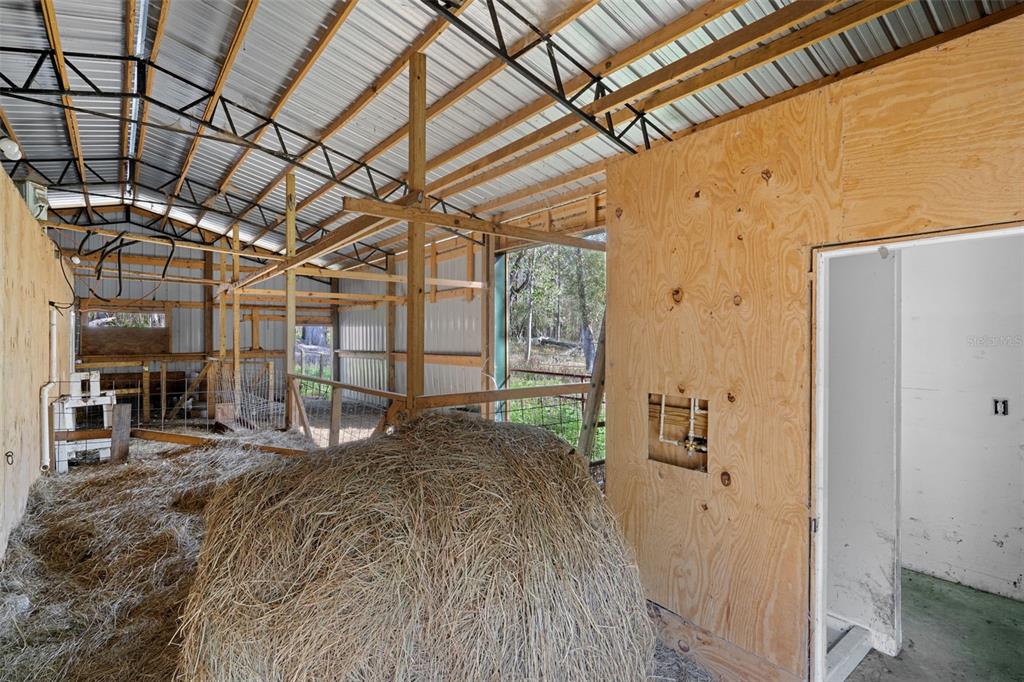 22439 Bull Run Road Brooksville, FL 34602 - Photo 41 of 66 a bed sitting in a room next to a window