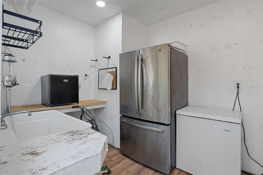 22439 Bull Run Road Brooksville, FL 34602 - Photo 46 of 66 a kitchen with stainless steel appliances a refrigerator and a stove top oven