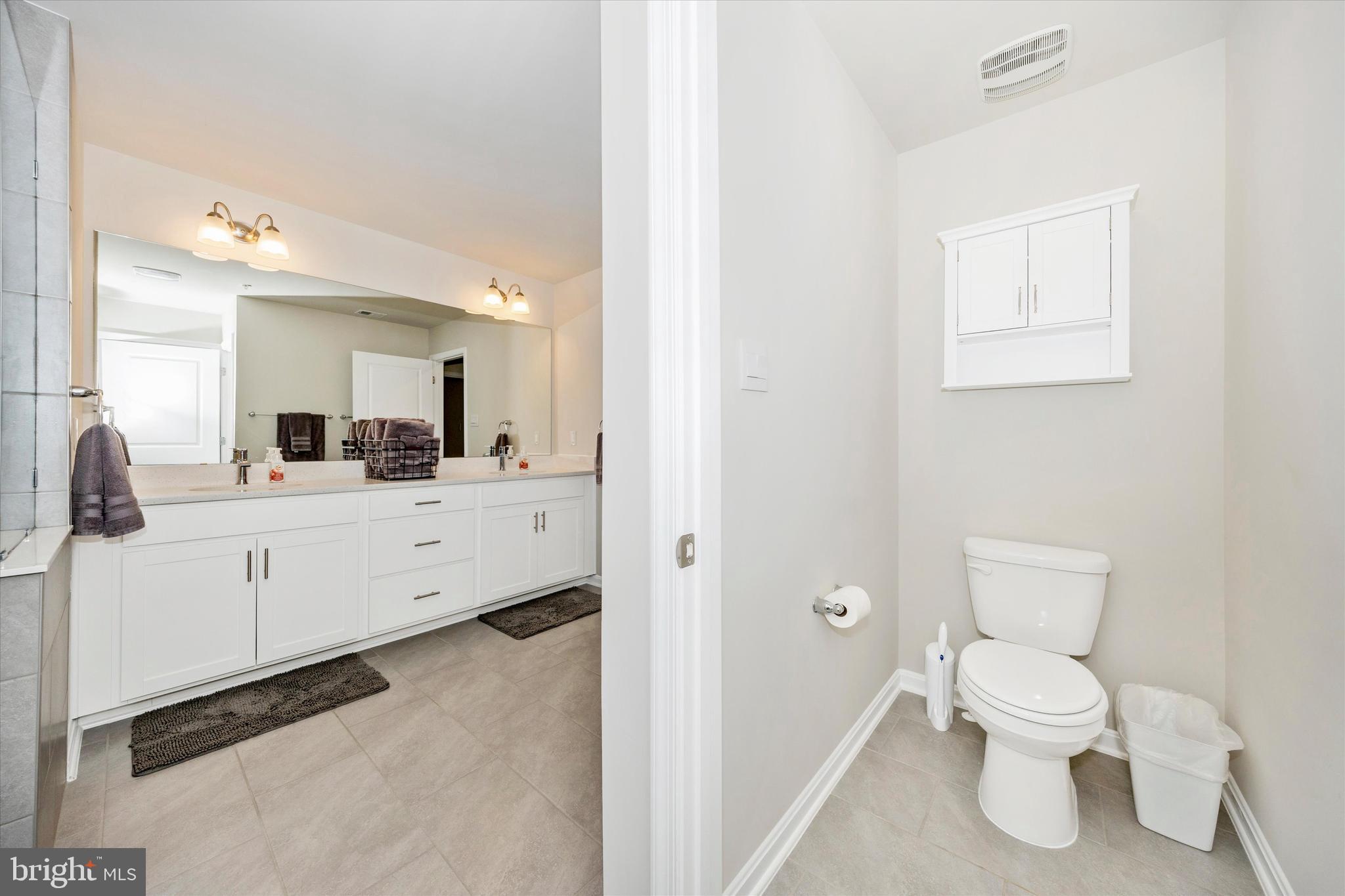 700 Bond Street Frederick, MD 21701 - Photo 22 of 49 a bathroom with a toilet sink and mirror