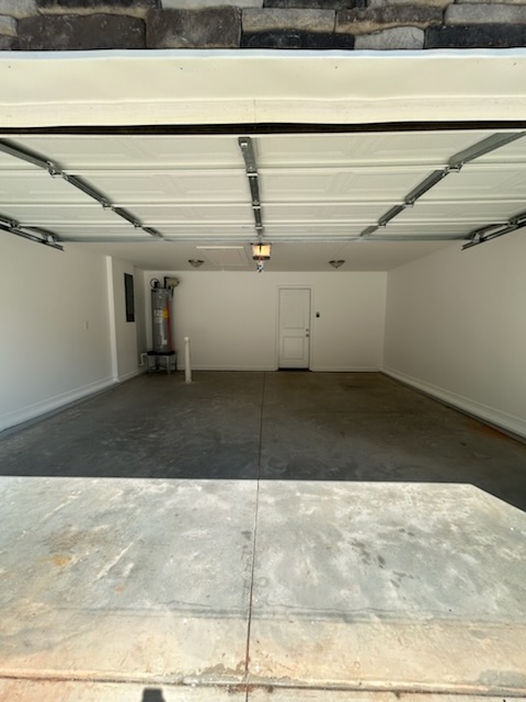 708 Hampton Street Iva, SC 29655 - Photo 3 of 14 This spacious garage offers practical utility and easy access for vehicles and storage.