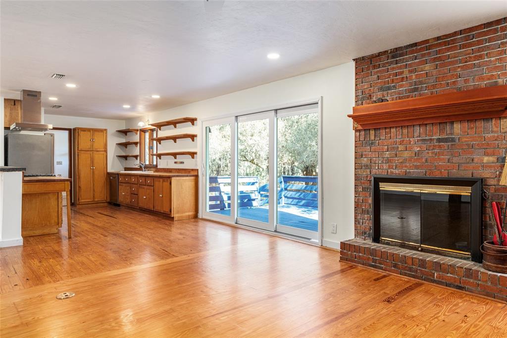 22157 Northwest 87th Avenue Road Micanopy, FL 32667 - Photo 12 of 34 a view of a livingroom with a fireplace
