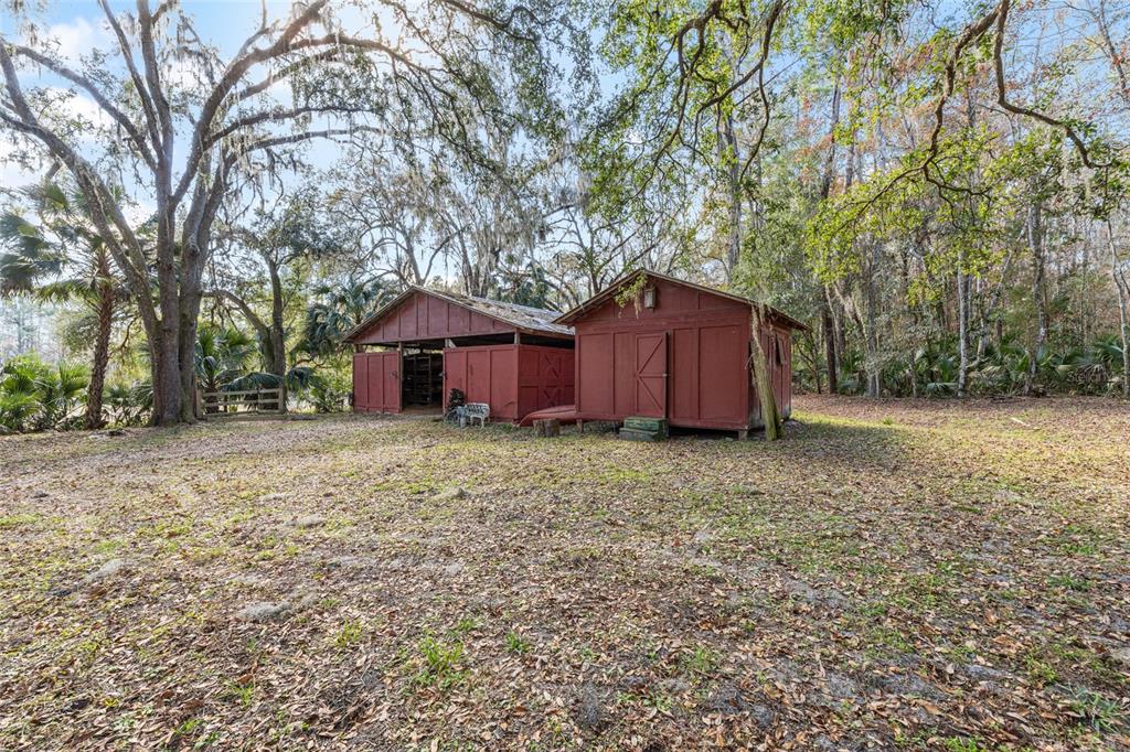 22157 Northwest 87th Avenue Road Micanopy, FL 32667 - Photo 23 of 34 a house view with a backyard space