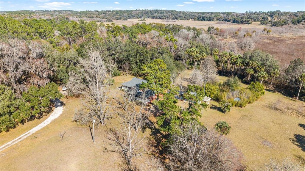 22157 Northwest 87th Avenue Road Micanopy, FL 32667 - Photo 31 of 34 a view of lake with mountain