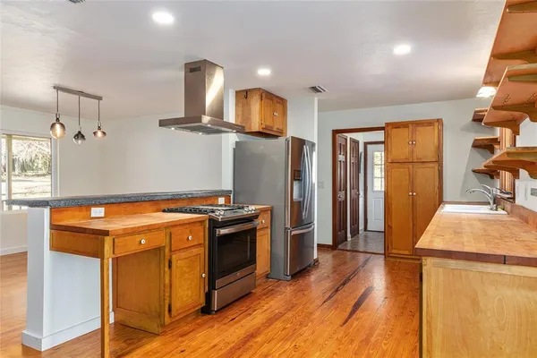 a large kitchen with a large window