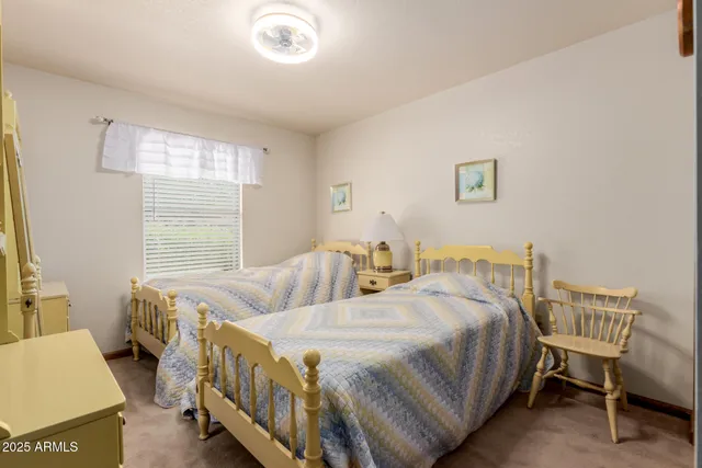 a bedroom with a bed and a cabinets