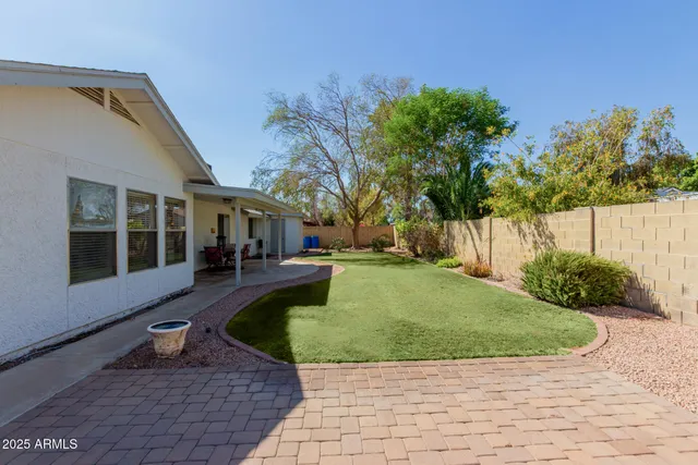 a view of a balcony with chair and table