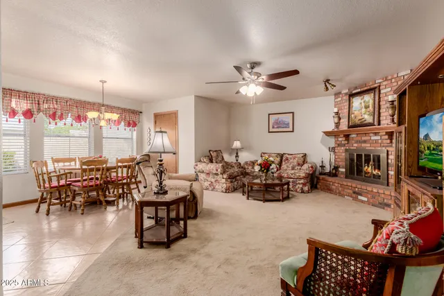 a living room with furniture flowerpot and a fireplace