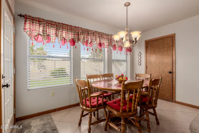a view of a dining room with furniture window and outside view