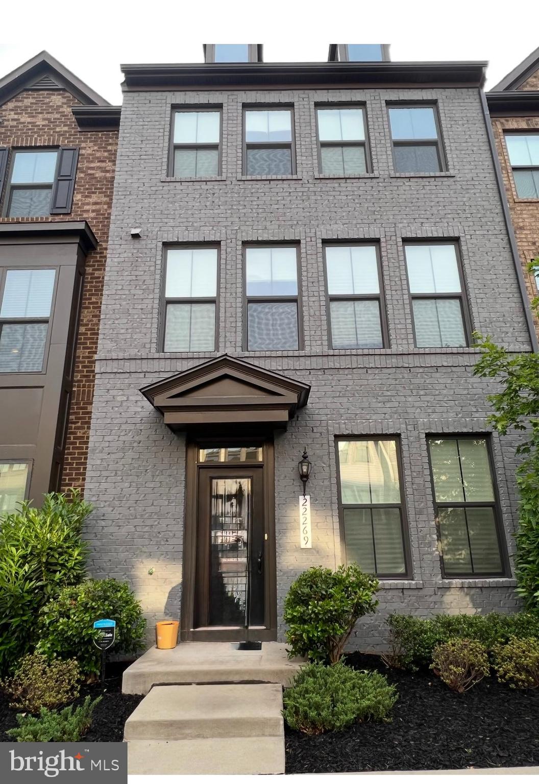 22269 Sims Terrace Ashburn, VA 20148 - Photo 1 of 44 a front view of a house