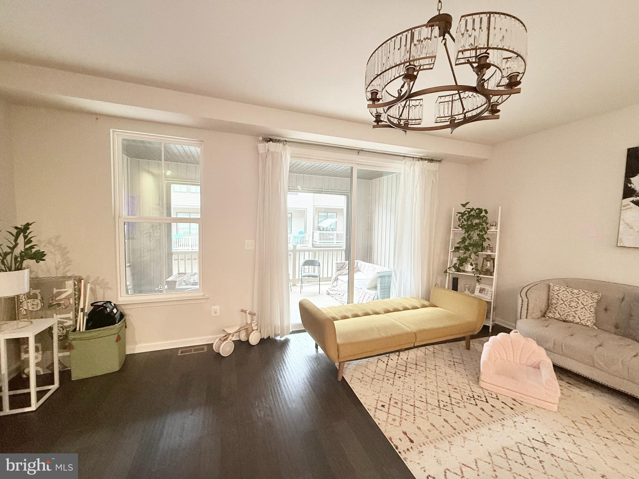 22269 Sims Terrace Ashburn, VA 20148 - Photo 18 of 44 a bedroom with furniture and a large window