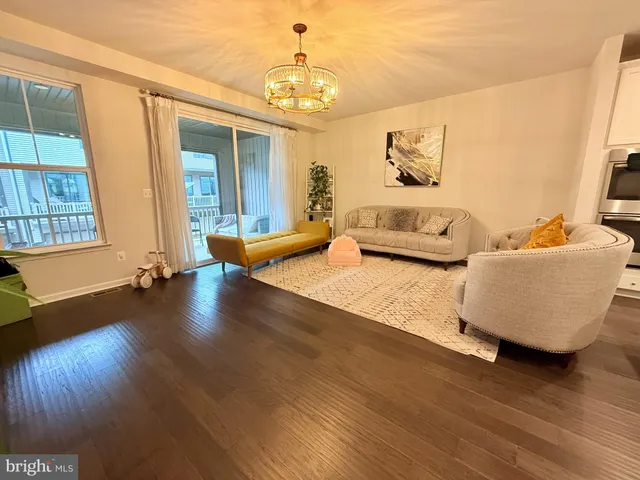 a bedroom with furniture and wooden floor