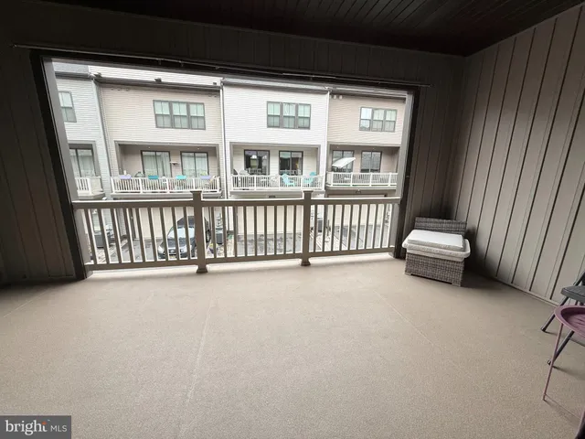 a view of a couches and a floor to ceiling window