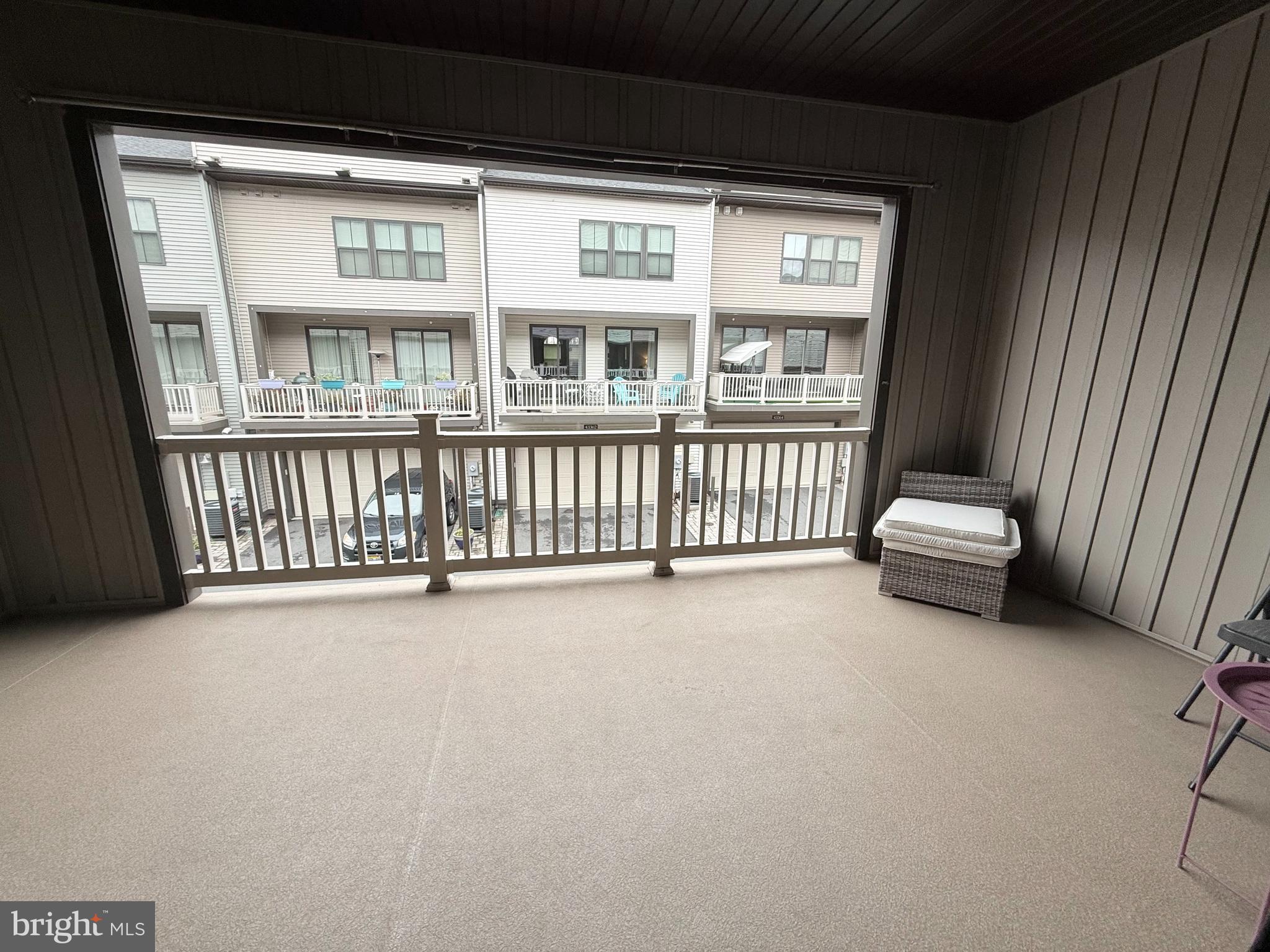 22269 Sims Terrace Ashburn, VA 20148 - Photo 24 of 44 a view of a couches and a floor to ceiling window