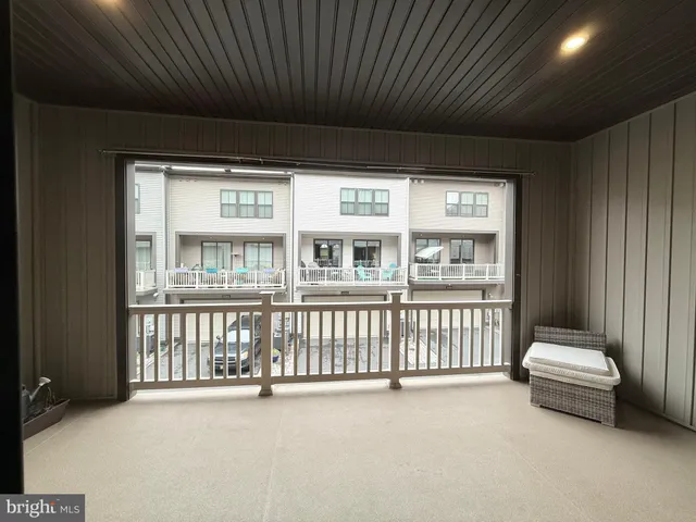 a view of a balcony with furniture
