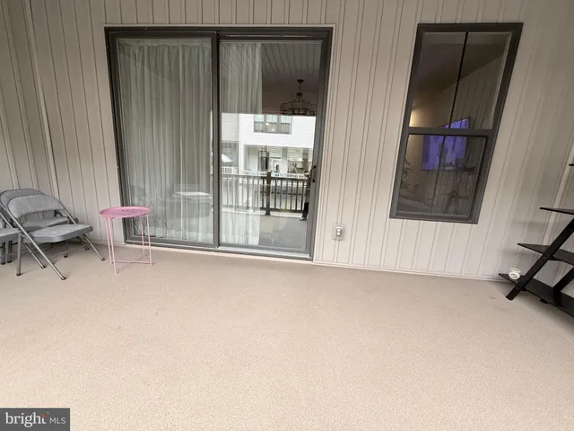 a view of front door and bedroom