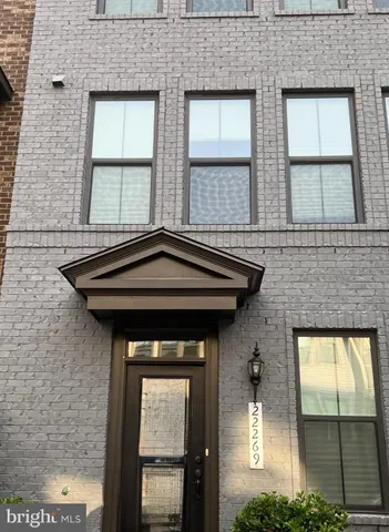 a front view of a house with a outdoor space