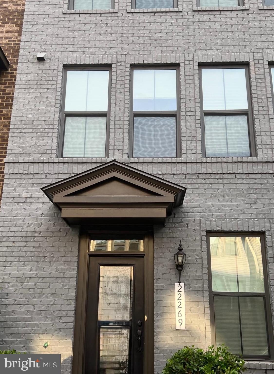 22269 Sims Terrace Ashburn, VA 20148 - Photo 3 of 44 a front view of a house with a outdoor space