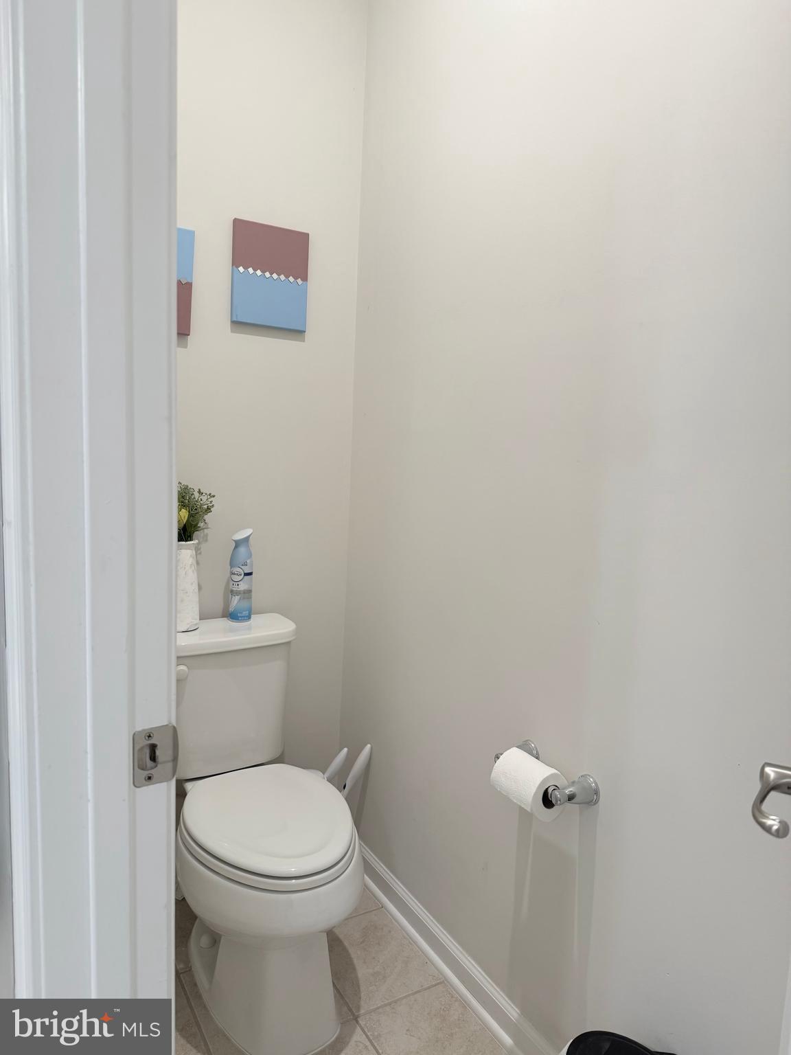 22269 Sims Terrace Ashburn, VA 20148 - Photo 33 of 44 a white toilet sitting next to a bathroom sink