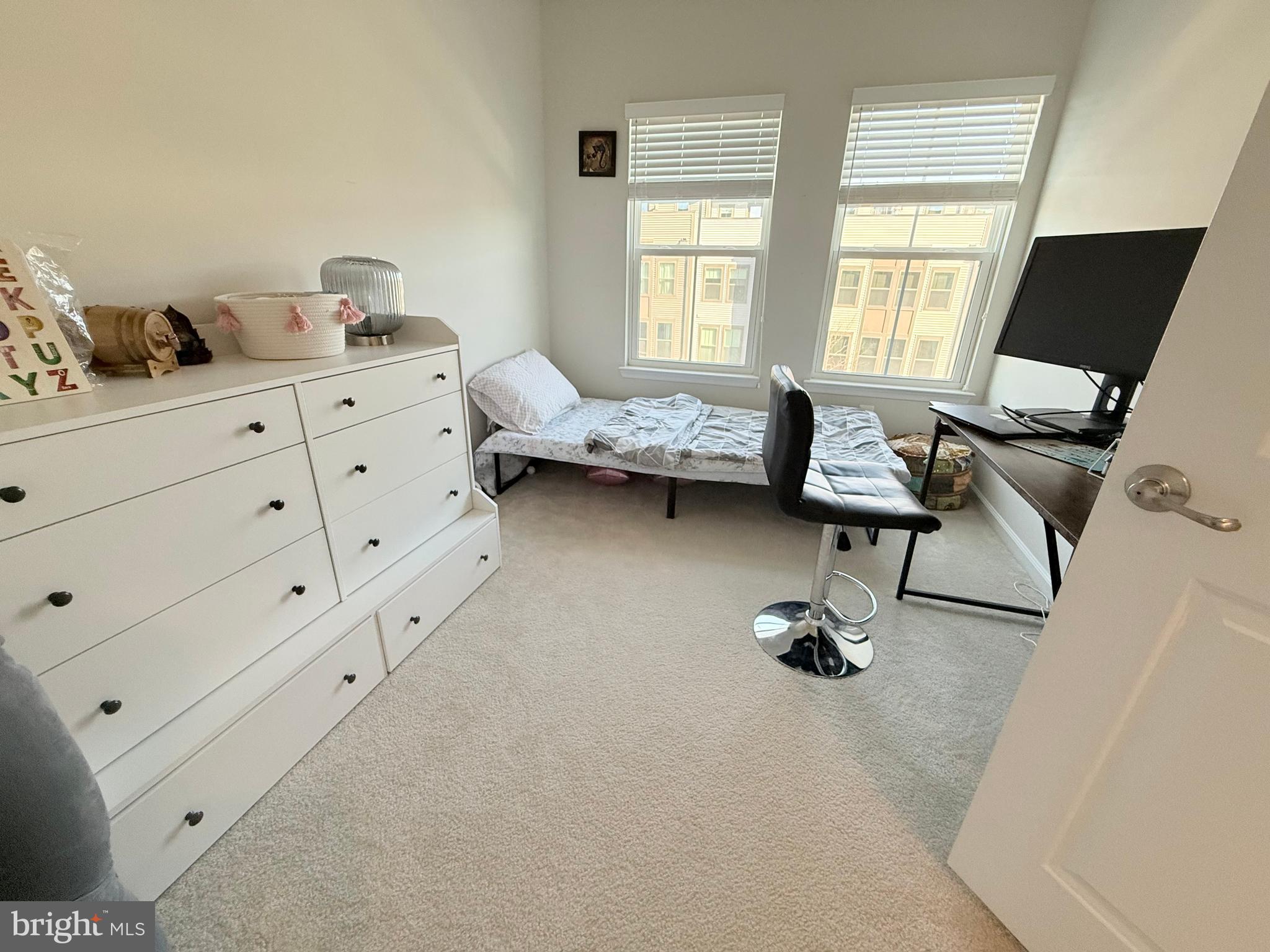 22269 Sims Terrace Ashburn, VA 20148 - Photo 39 of 44 a view of a workspace with furniture and a window