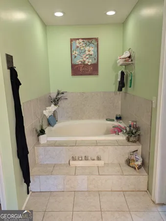 a bathroom with a bathtub and a sink