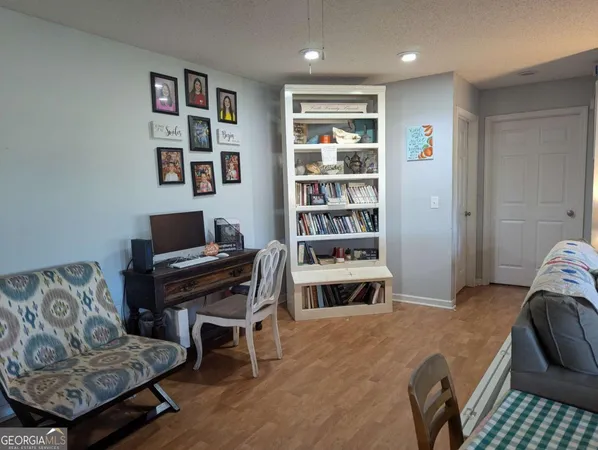 a livingroom with a workspace