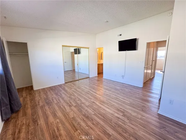 a view of a livingroom with wooden floor