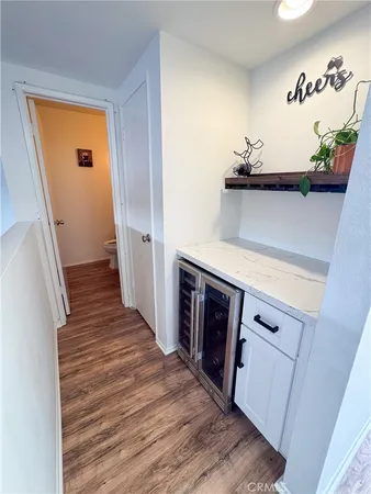 a kitchen with a refrigerator and a stove