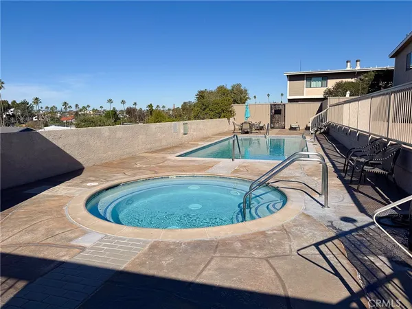 a view of a swimming pool with a back yard