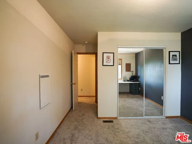 a view of a livingroom with furniture and a window