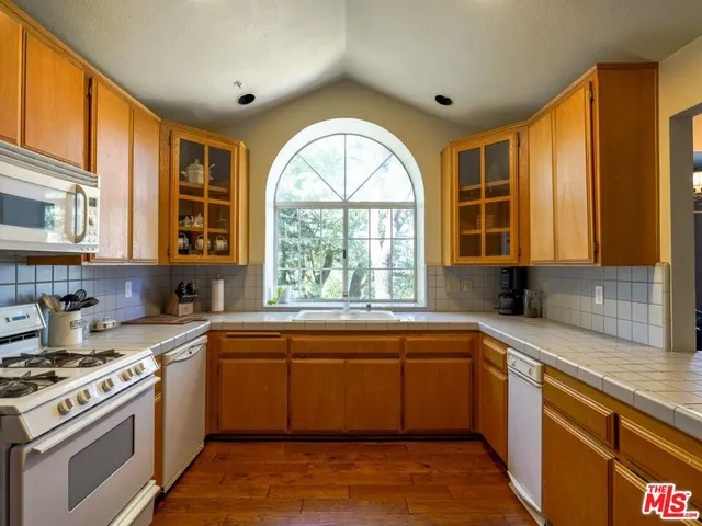 a kitchen that has a sink and a stove