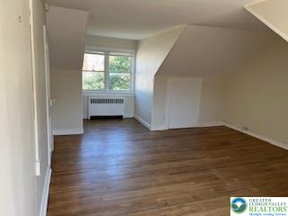 216 Cattell Street, Unit B Easton, PA 18042 - Photo 11 of 14 a view of livingroom with hardwood floor and window
