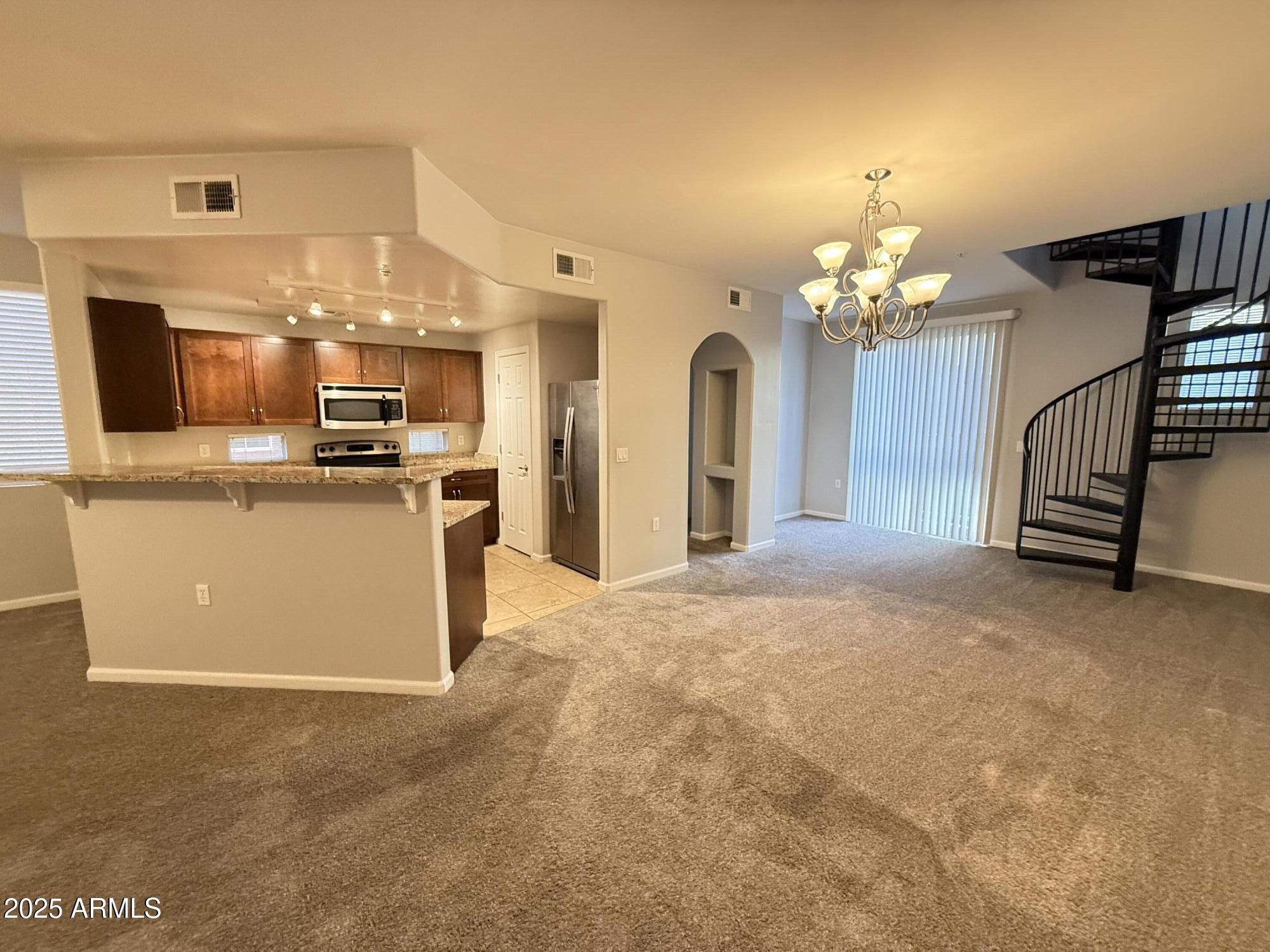 1920 East Bell Road, Unit 1149 Phoenix, AZ 85022 - Photo 11 of 33 a view of a kitchen with a sink and cabinets