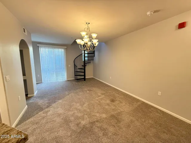 an empty room with a chandelier