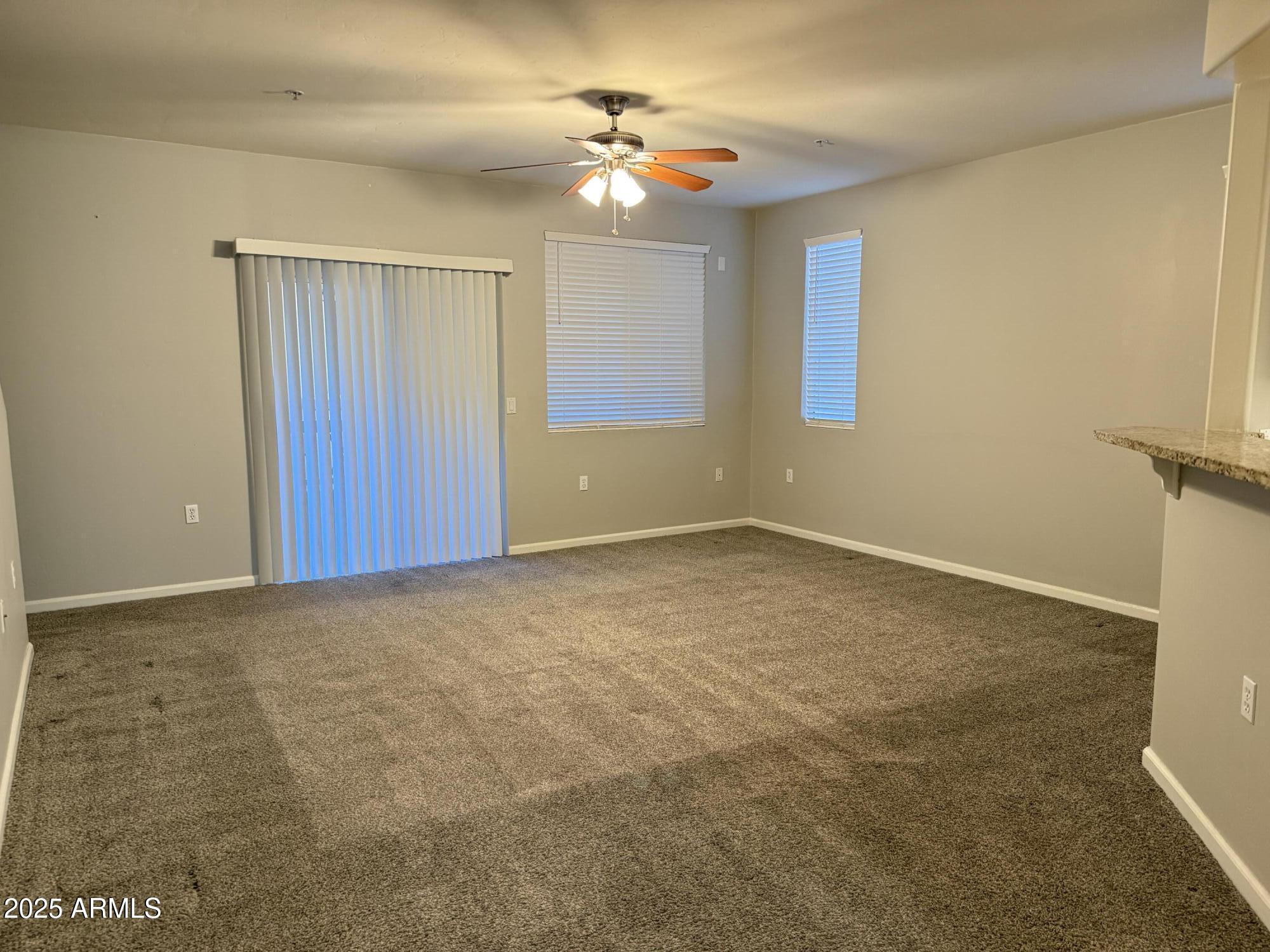1920 East Bell Road, Unit 1149 Phoenix, AZ 85022 - Photo 17 of 33 a view of an empty room with a window