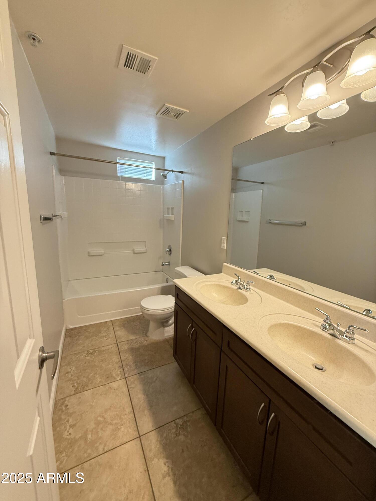1920 East Bell Road, Unit 1149 Phoenix, AZ 85022 - Photo 23 of 33 a bathroom with a sink a toilet and shower