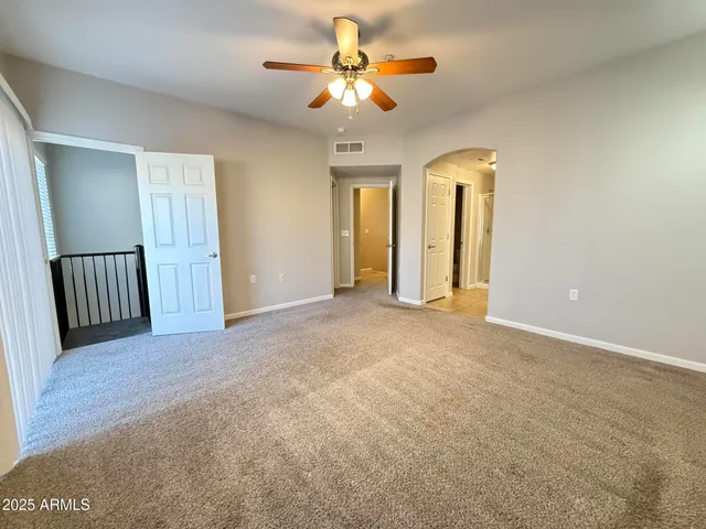 a view of a livingroom with a chandelier fan