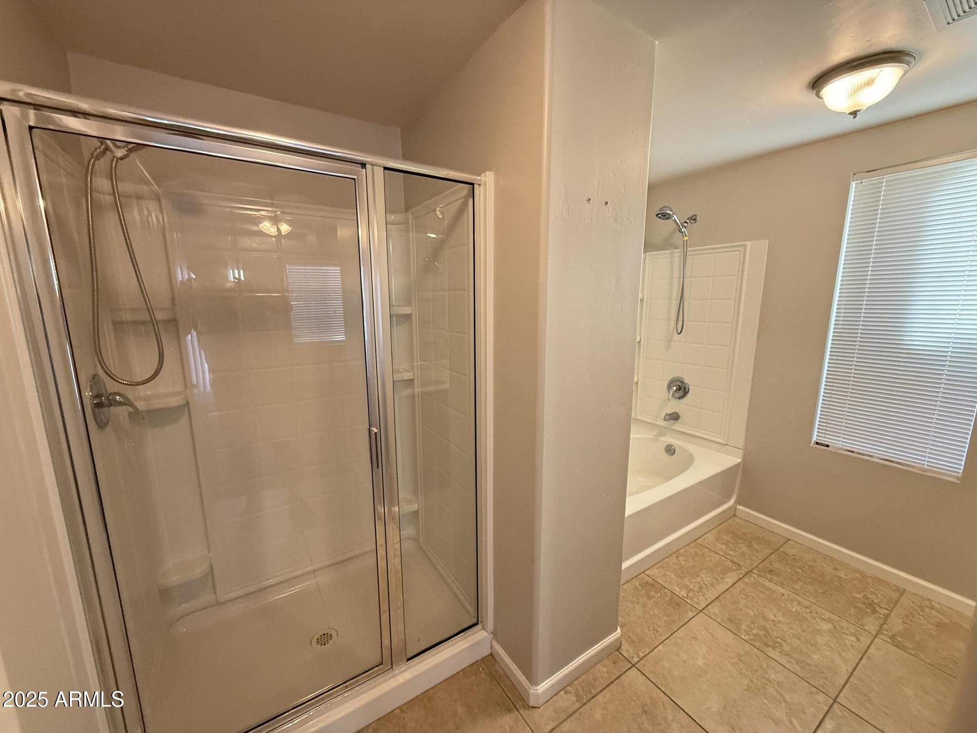 1920 East Bell Road, Unit 1149 Phoenix, AZ 85022 - Photo 27 of 33 a bathroom with a glass shower door