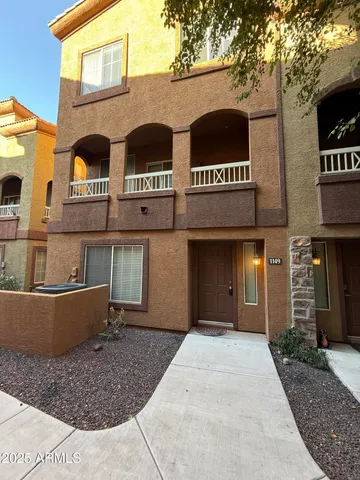 a view of a brick building with many windows