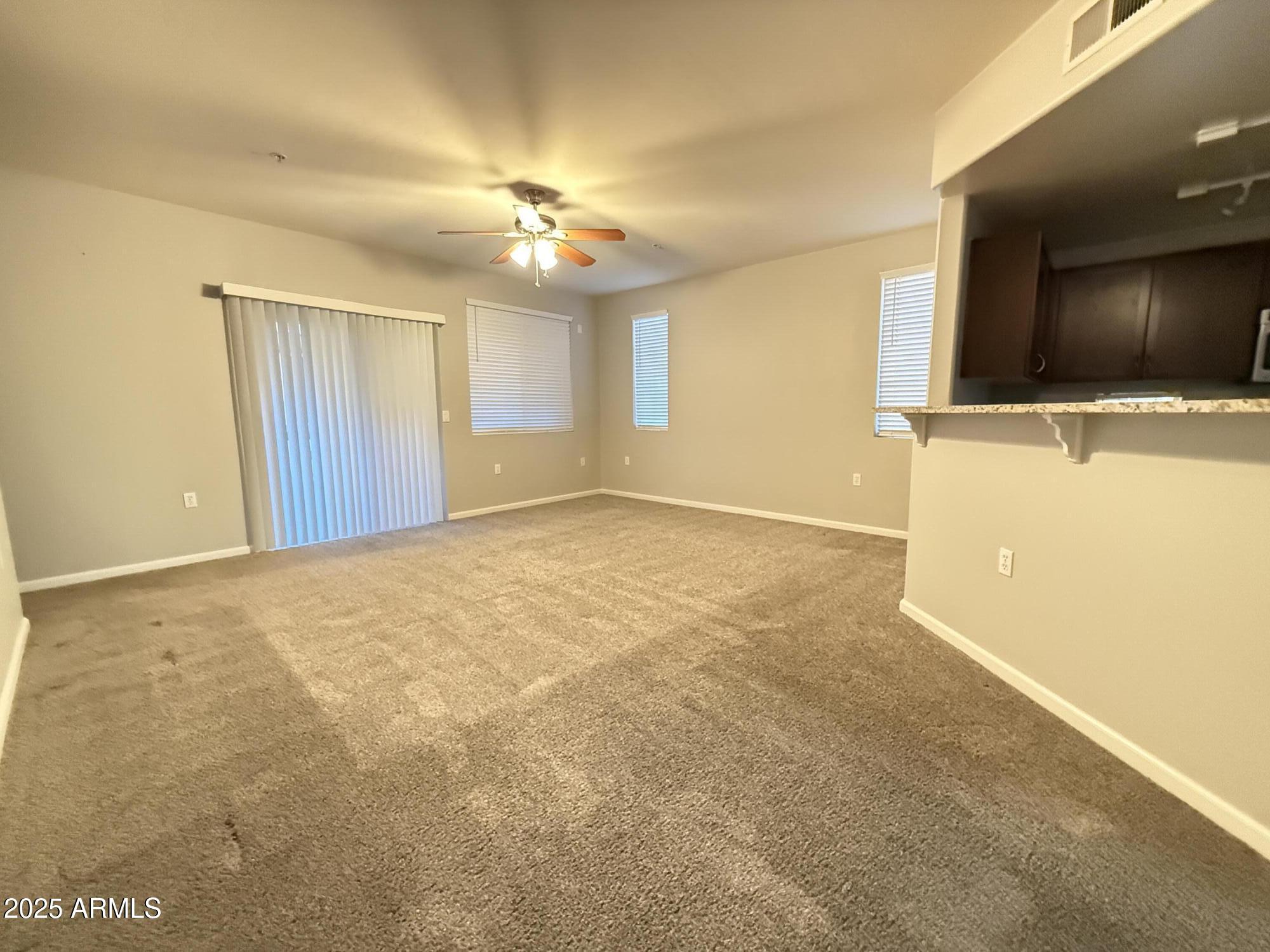 1920 East Bell Road, Unit 1149 Phoenix, AZ 85022 - Photo 9 of 33 a view of a livingroom with a flat screen tv