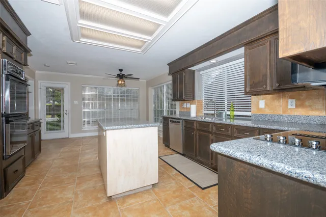 a kitchen with refrigerator and cabinets