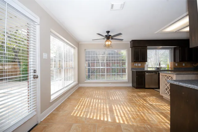 a view of a kitchen with a sink and a large window