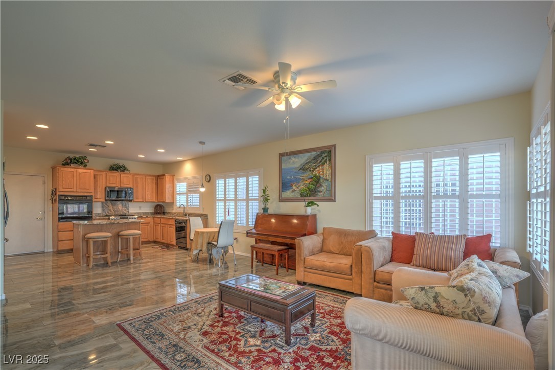 3002 Hickory Valley Road Henderson, NV 89052 - Photo 13 of 58 SEPARATE FAMILY ROOM WITH
CEILING FAN, AND 2-WAY GAS
FIREPLACE